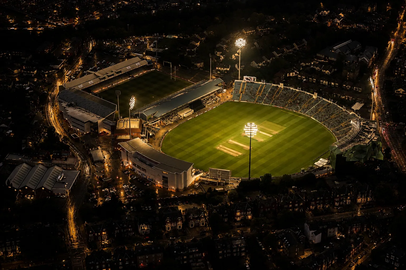 Aerial night view of Headingley Stadium in Leeds, floodlit above the terraced student streets off Otley Road